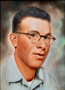 Oil painting portrait of a young man with short, dark, wavy hair and glasses wearing a light-blue collared shirt.